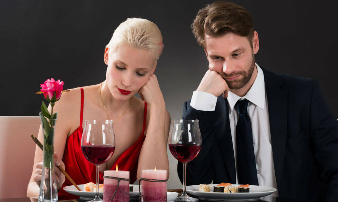 Man and woman bored by the question of who pays on the first date. 